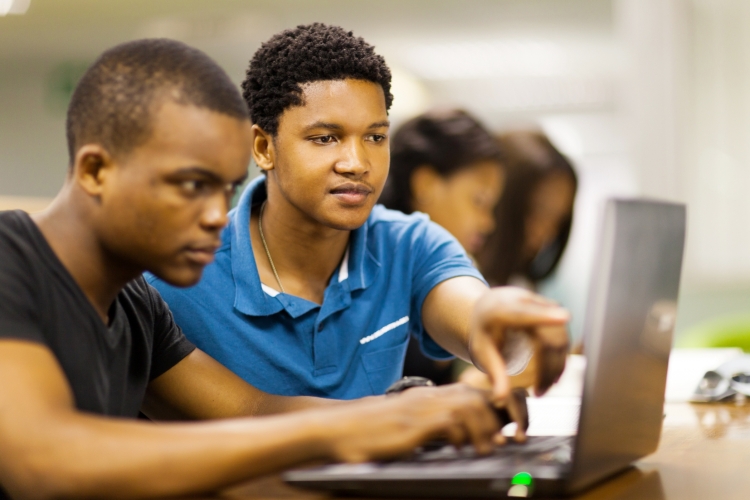Students working on a laptop