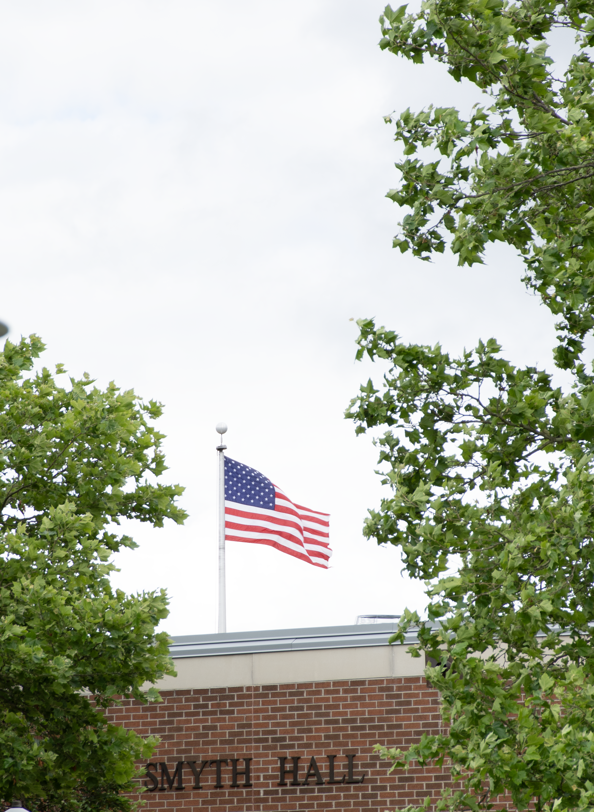 US flag flying over Smyth Hall