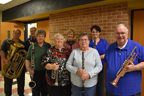 Eight founding members of the concert band still active in the band